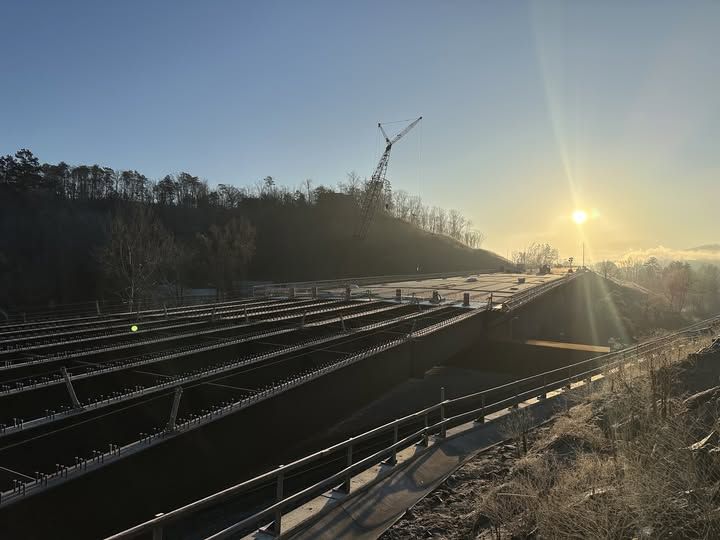 A beautiful sunrise greets workers on this crisp, clear morning over bridge number one on our Tennessee Department of Transportation SR 317