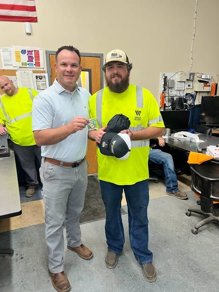 Austin Trew (right) was recently presented with a Wright Brothers Excellence Coin by Safety Director Michael Shirk for exemplifying our Core Value of Selflessness.
