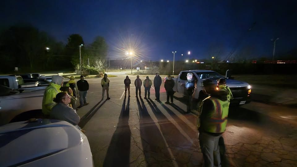 Diane Ray and Bryan Wade lead an early-morning safety meeting